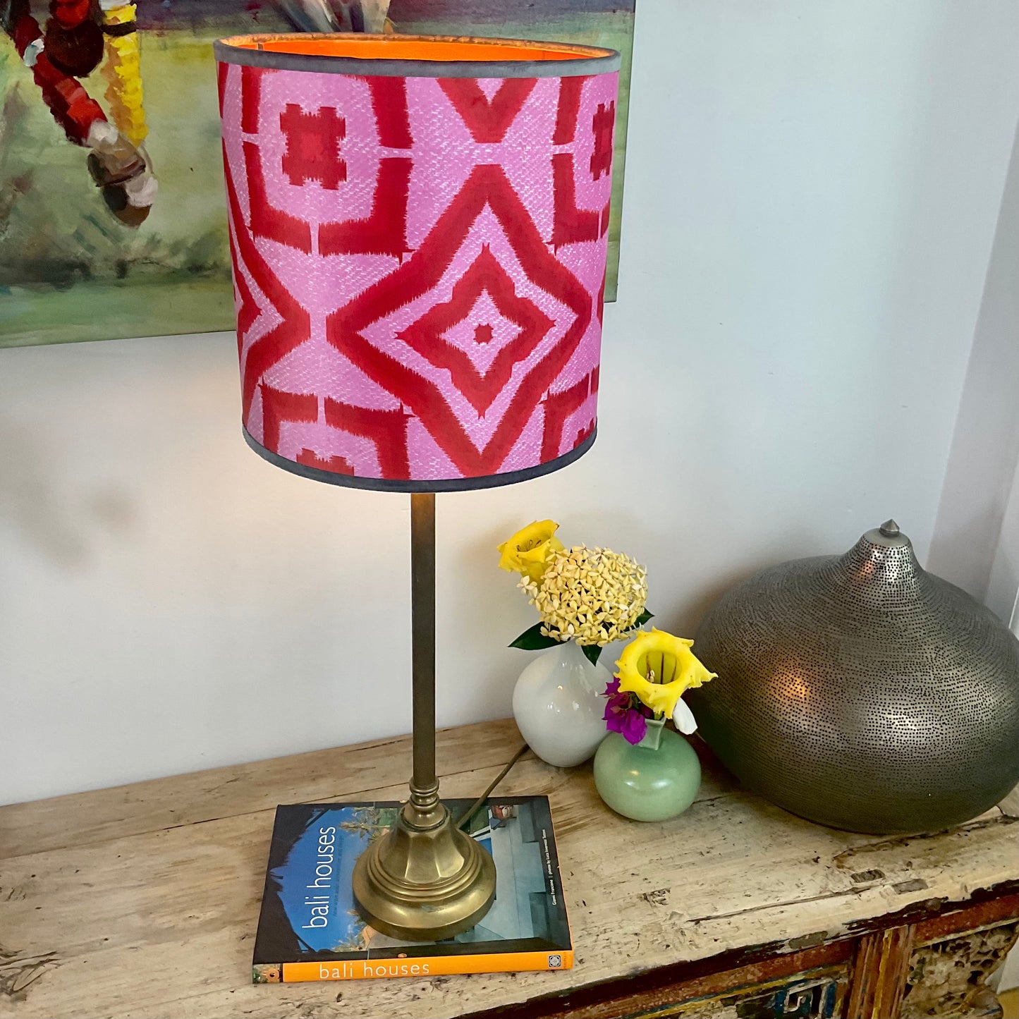 Red ikat design lampshade with brass lamp base