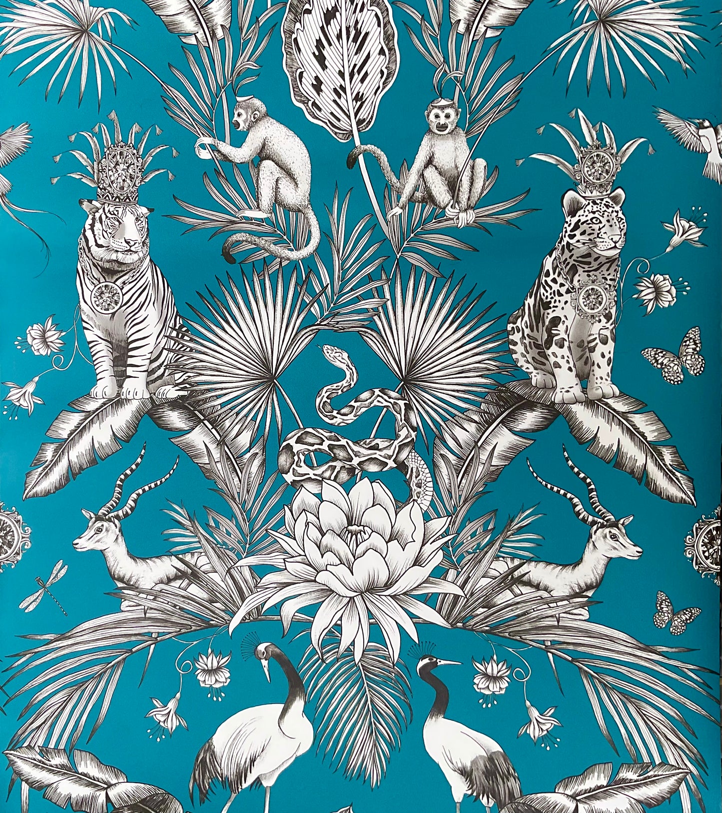 Tropical animal pattern on teal backgroumd