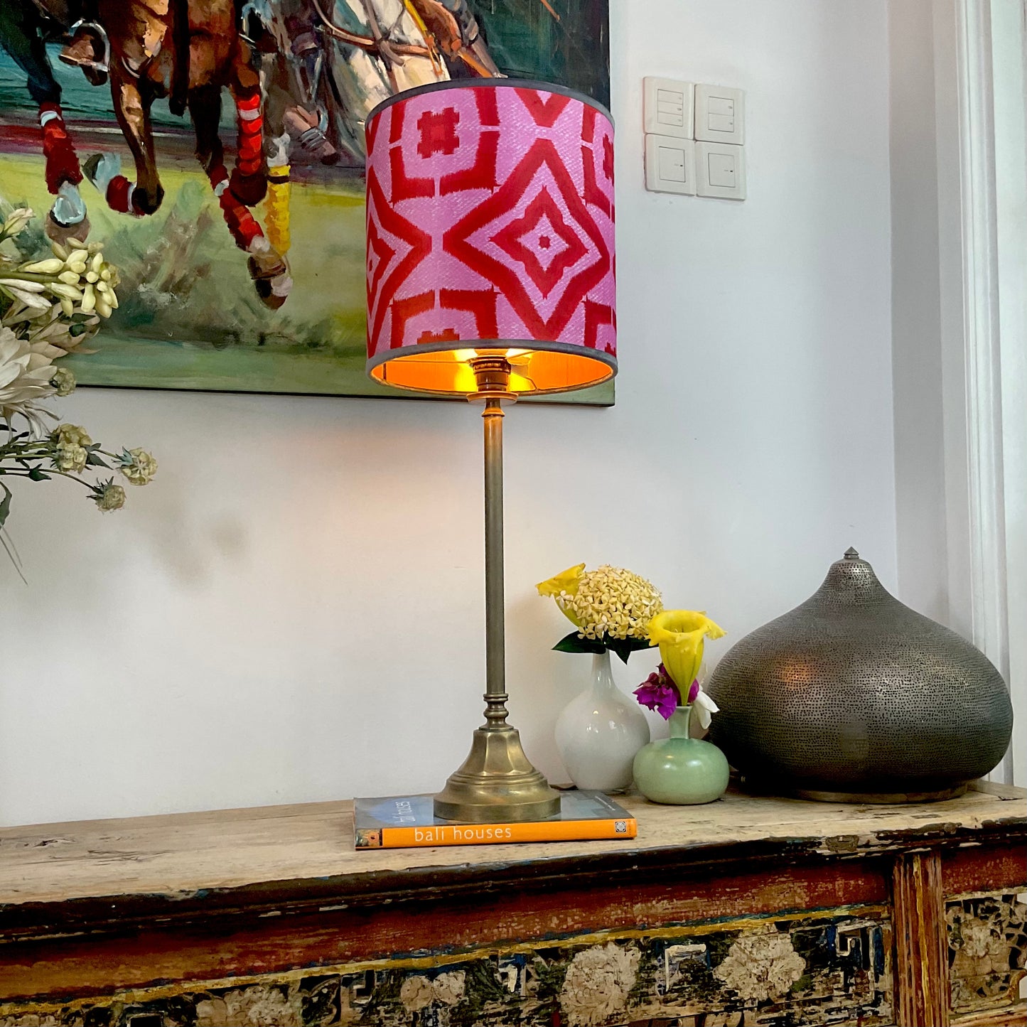 Red ikat pattern lampshade with brass lamp base