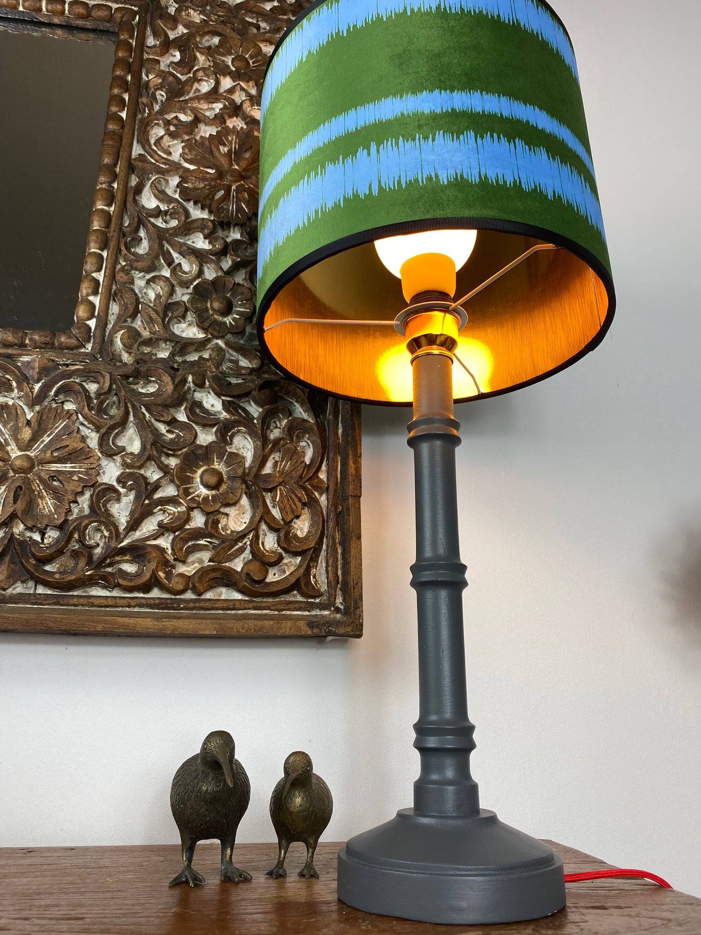 Gold lined lampshade with grey wooden table lamp