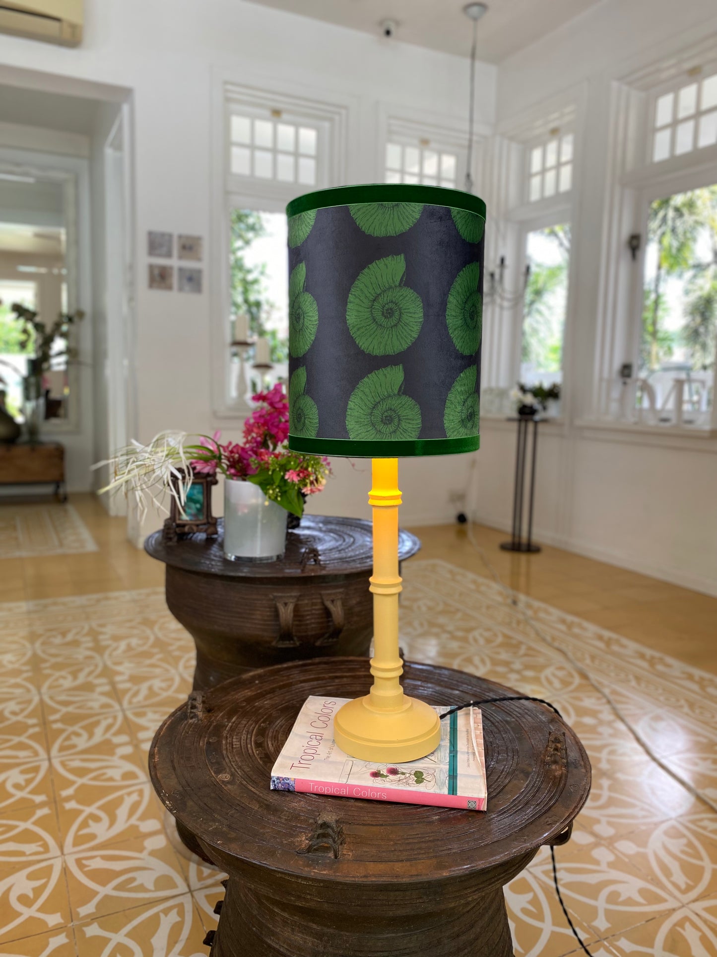Green seashell lampshade with yellow wooden lamp base