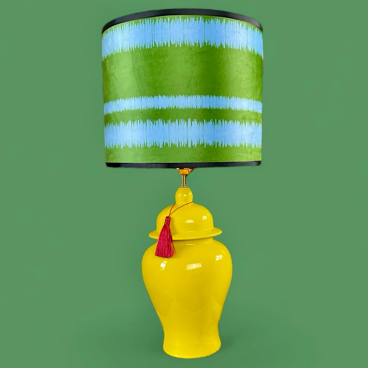 Blue green velvet lampshade with yellow ceramic table lamp