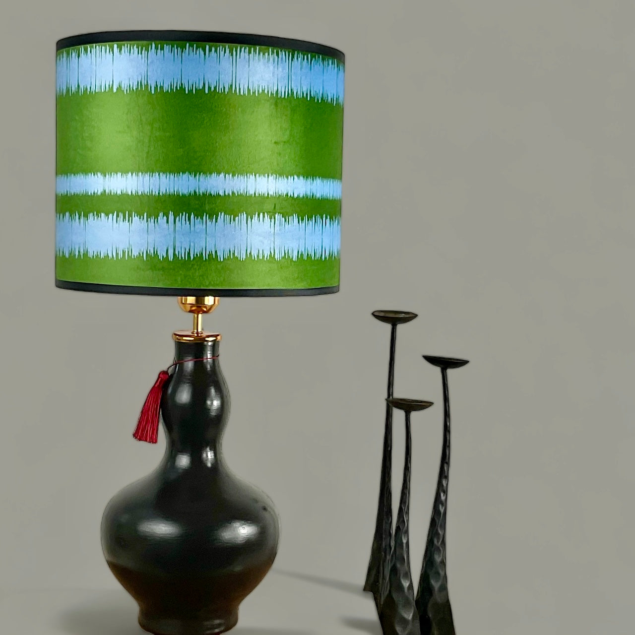 Striped blue green lampshade with black lampbase