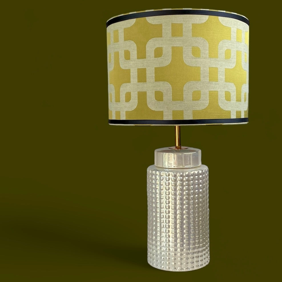 Gold geometric pattern lampshade with beige ceramic lamp base