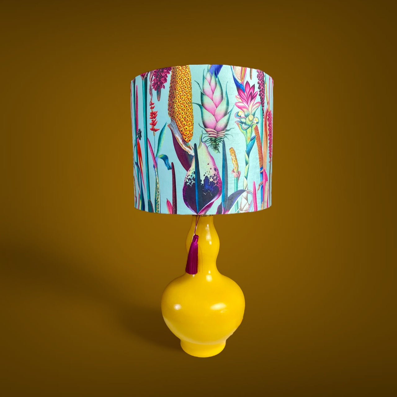 Light blue lampshade with yellow table lamp