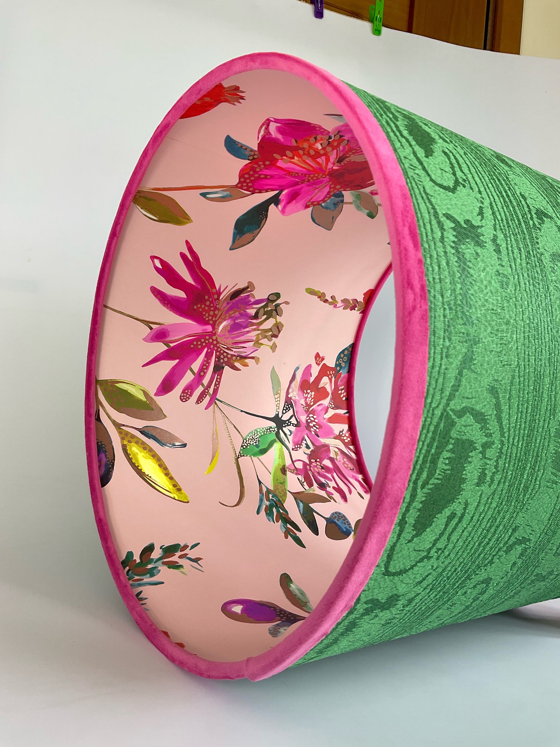 Green lampshade, inside lined with pink flowers