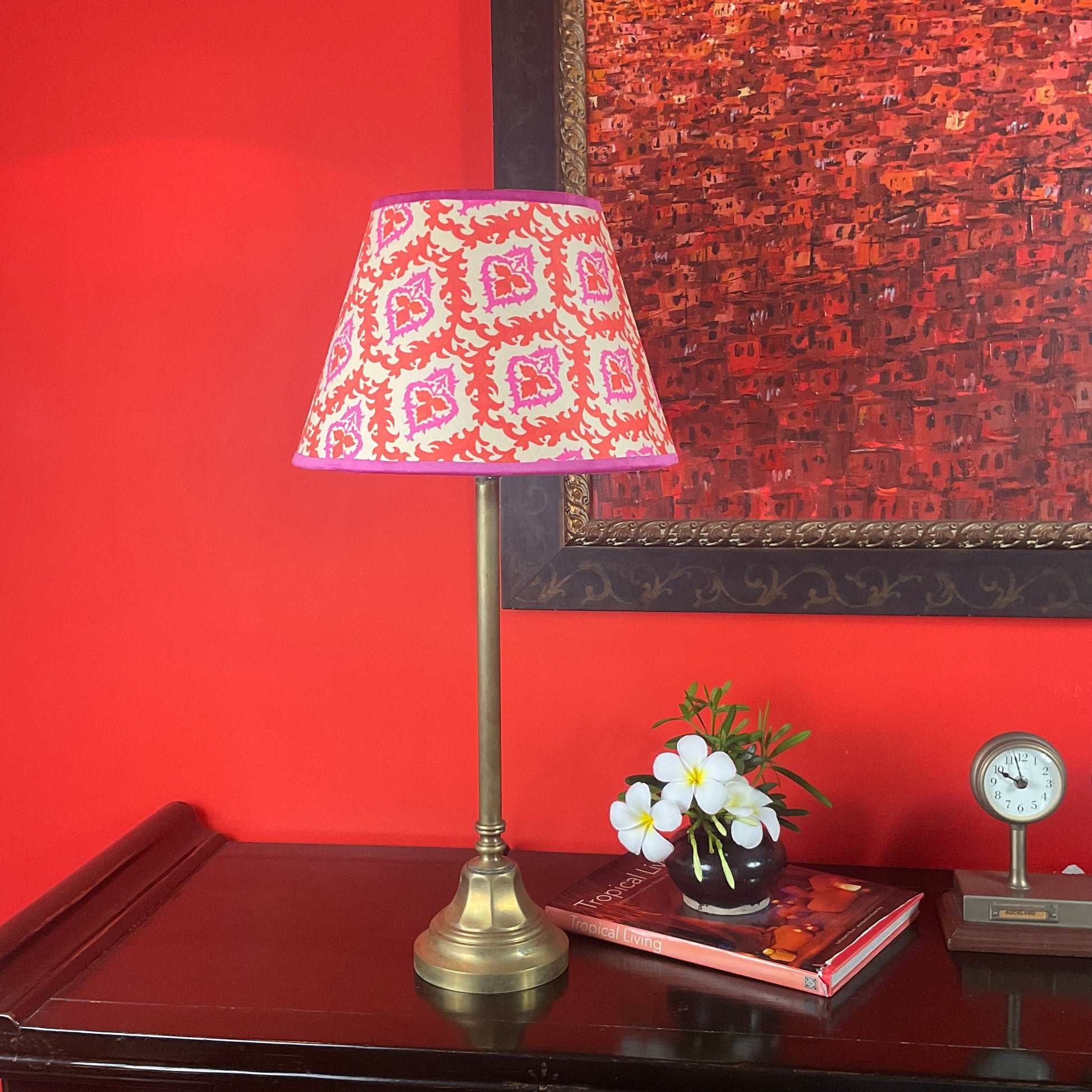 Cone shape pink and orange lampshade with brass lamp base