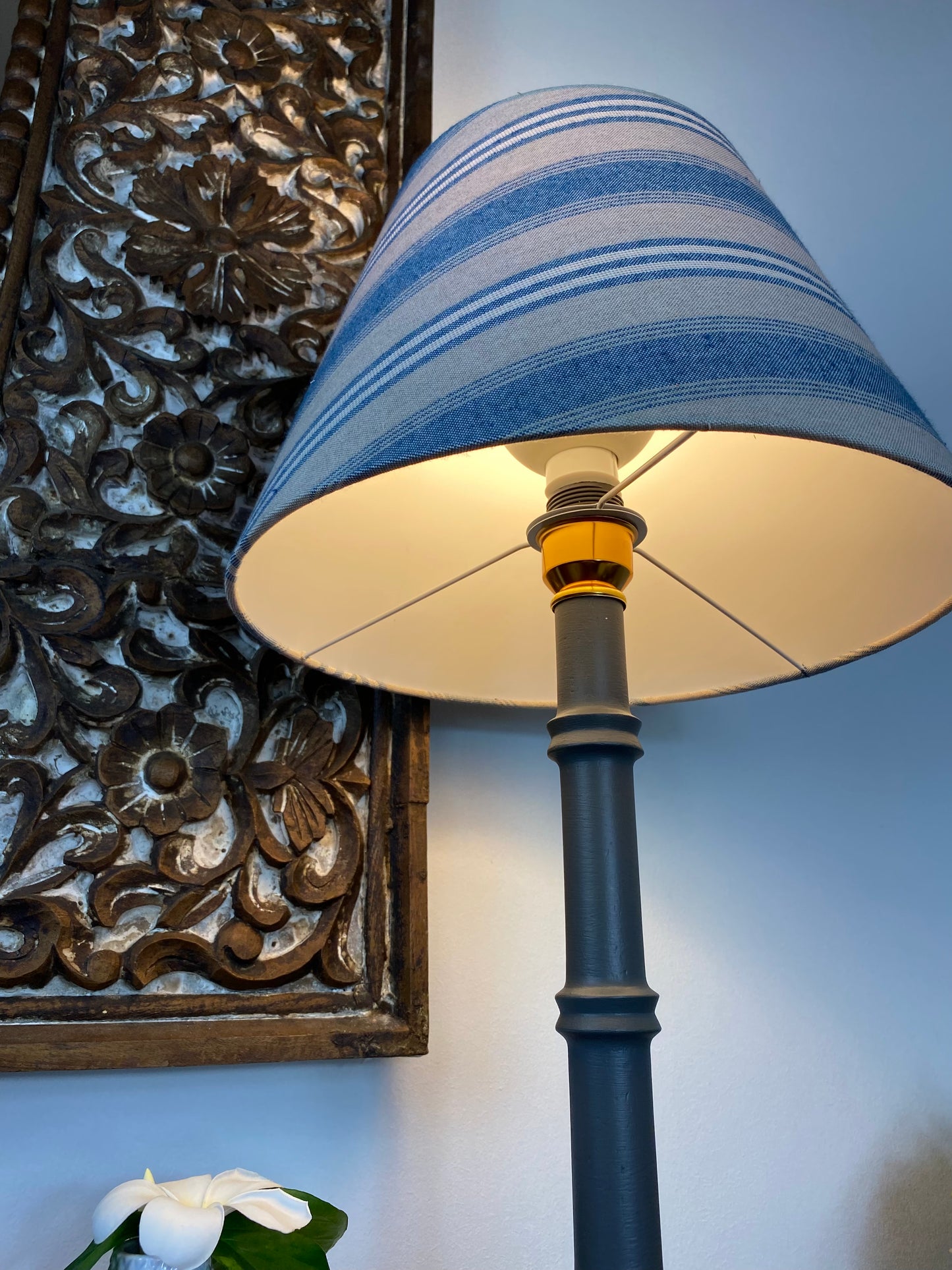 Bottom view of blue and beige lampshade when lit up