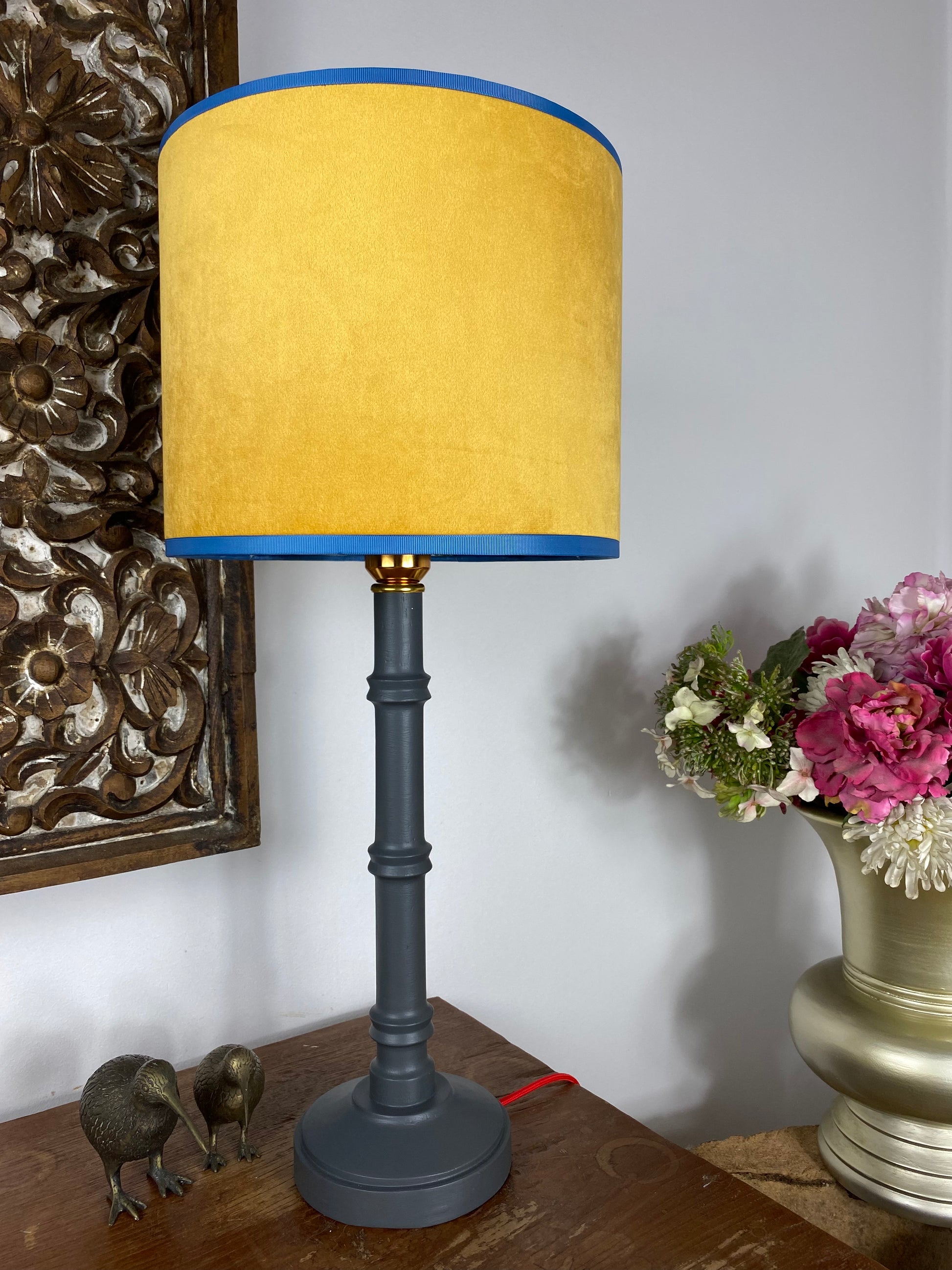 Yellow velvet lampshade with grey wooden table lamp