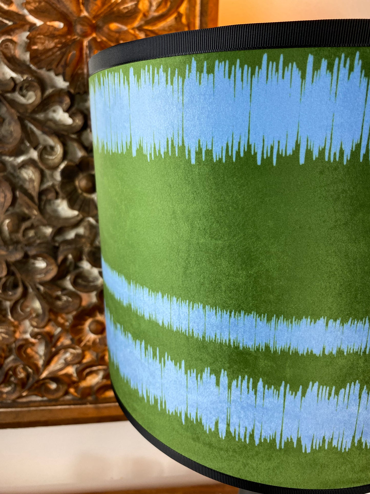 Close up blue green striped lampshade