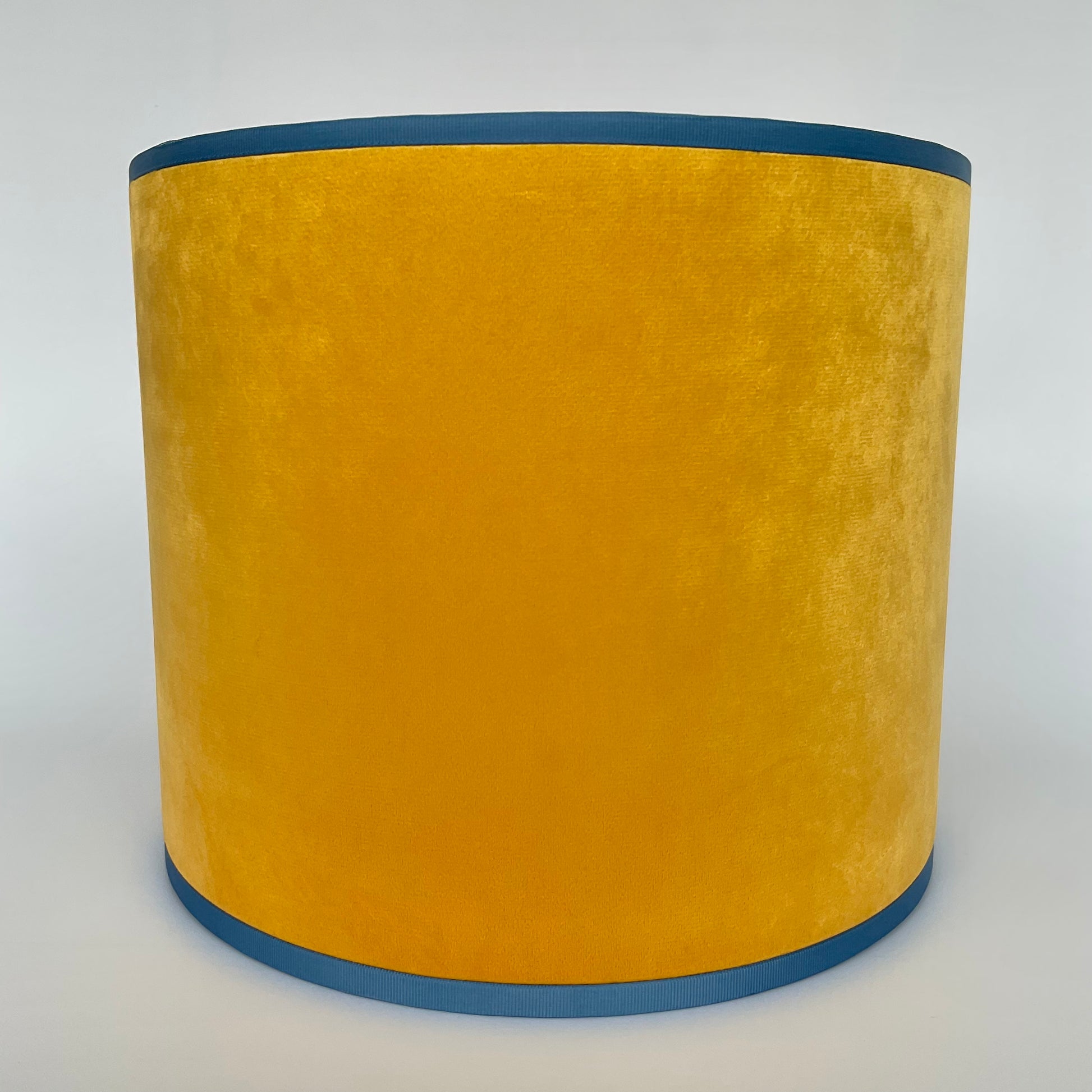 Close up of yellow velvet lampshade