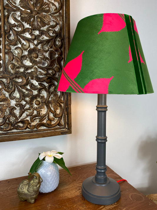 Pink and green ikat pattern lampshade with grey wooden table lamp