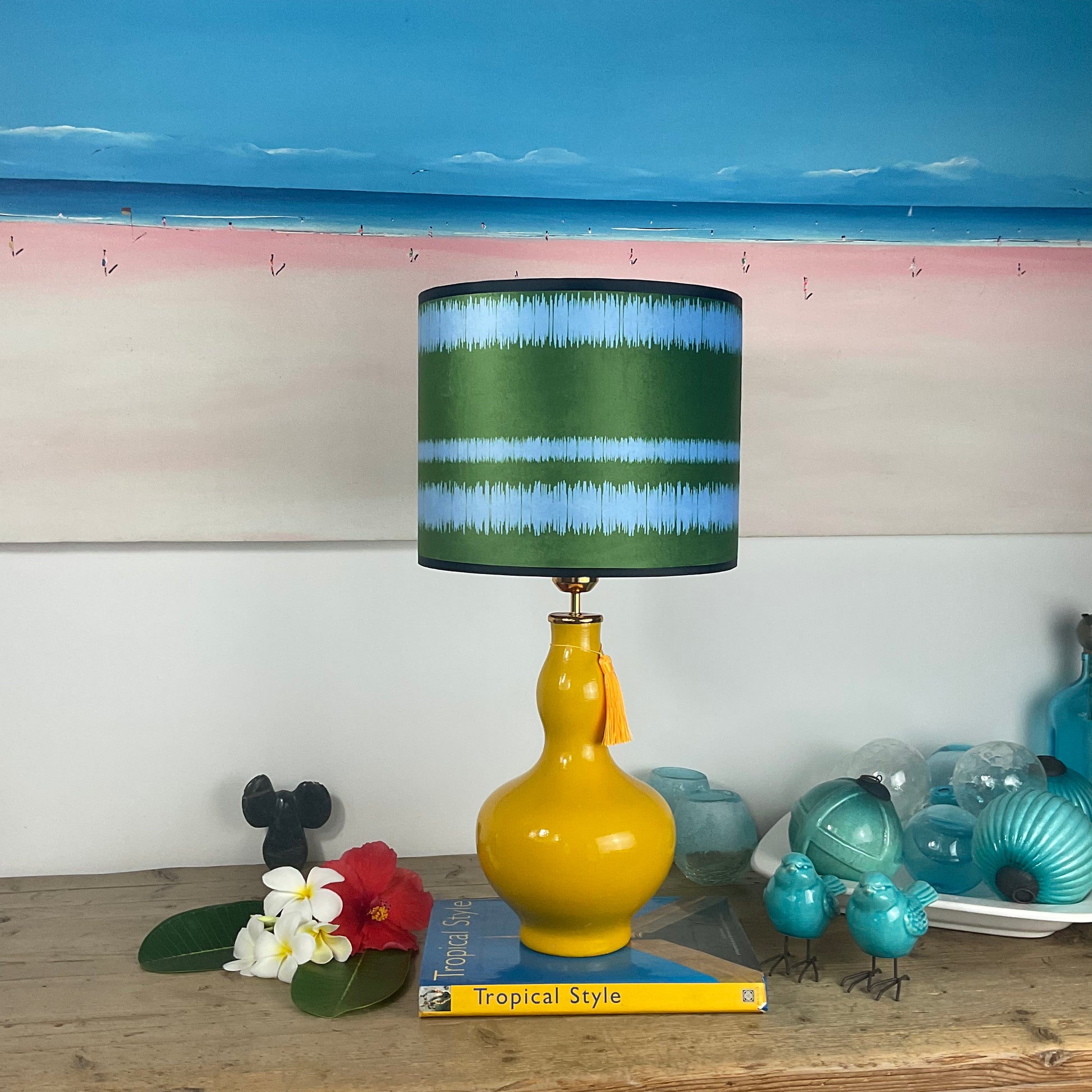 Striped blue green lampshade with yellow lamp base