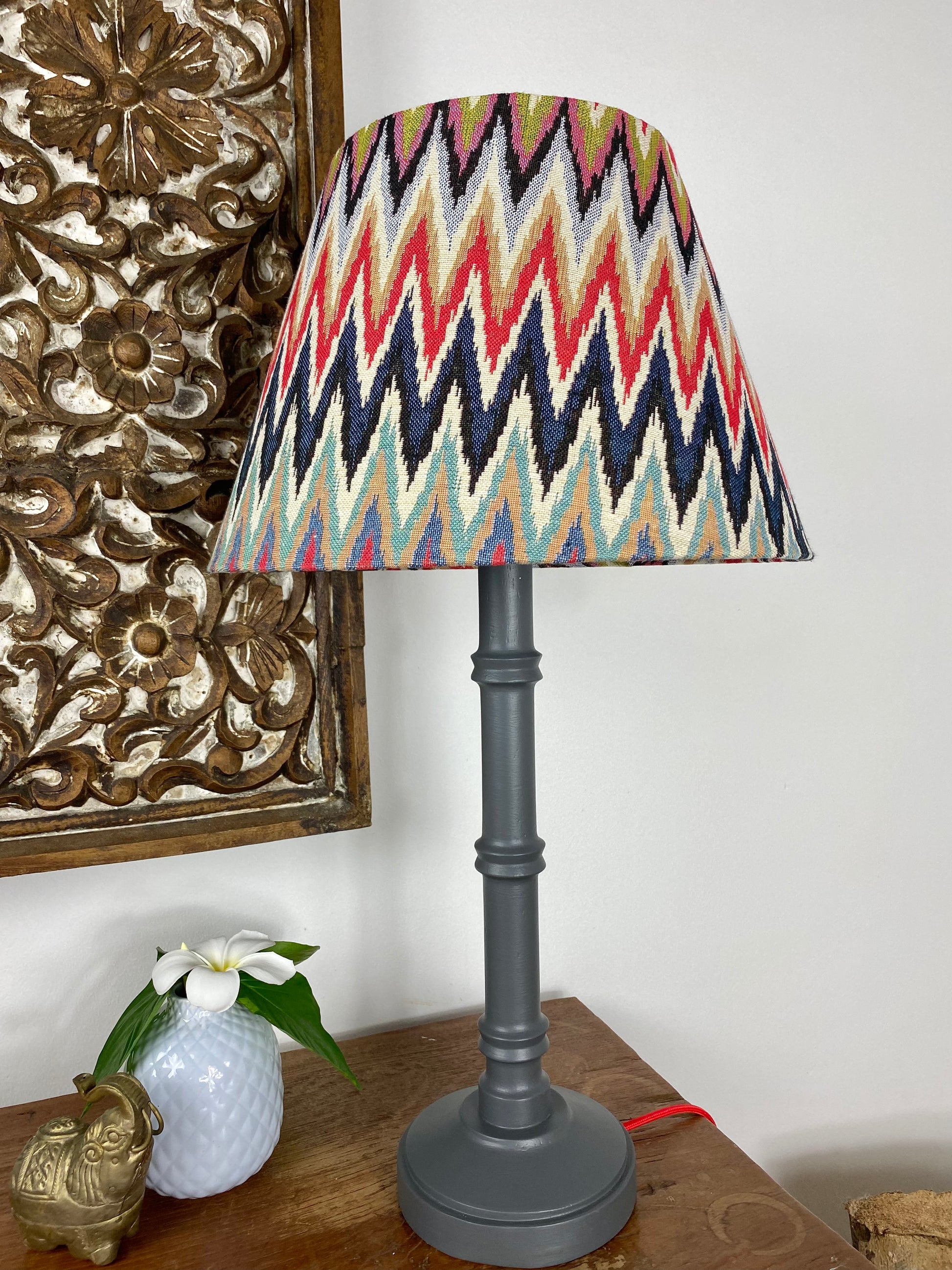 Empire shaped lampshade with grey wooden lamp