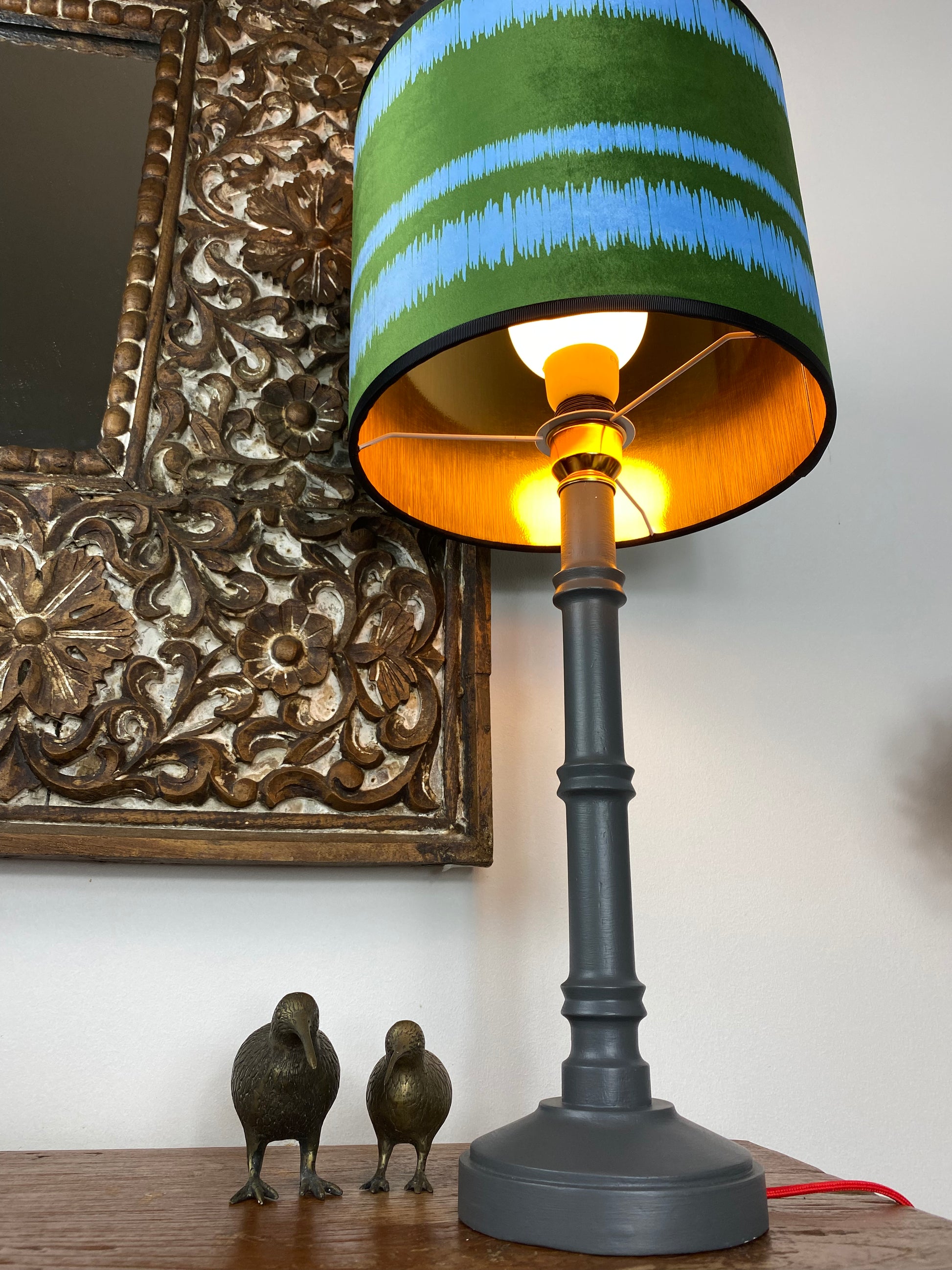 Gold lined lampshade with grey wooden table lamp 